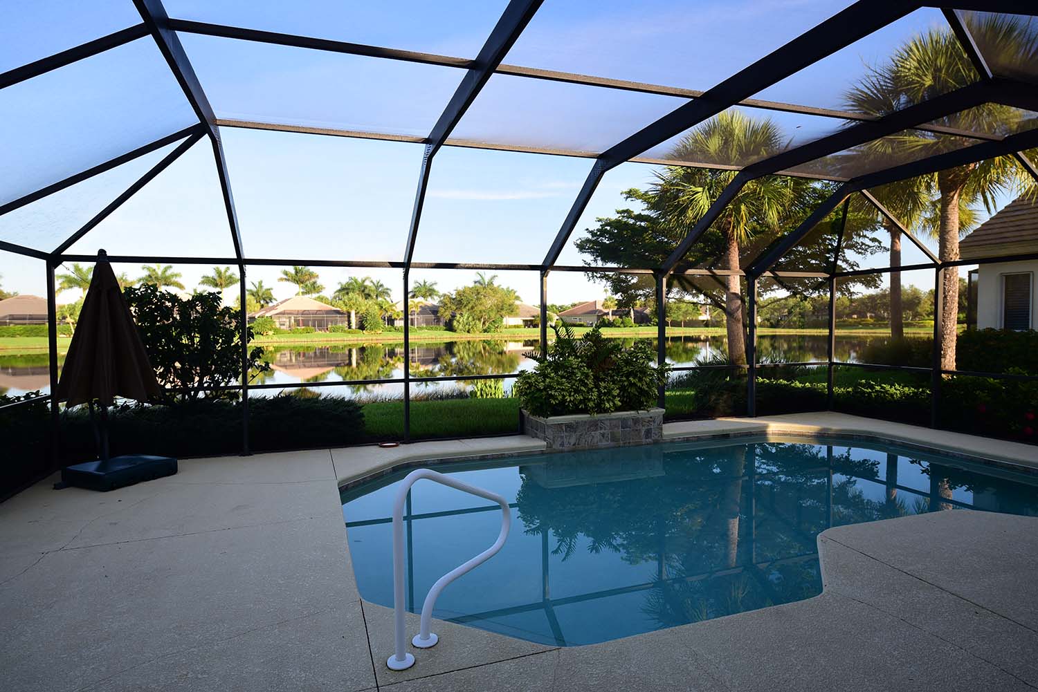 Screened outdoor area with swimming pool